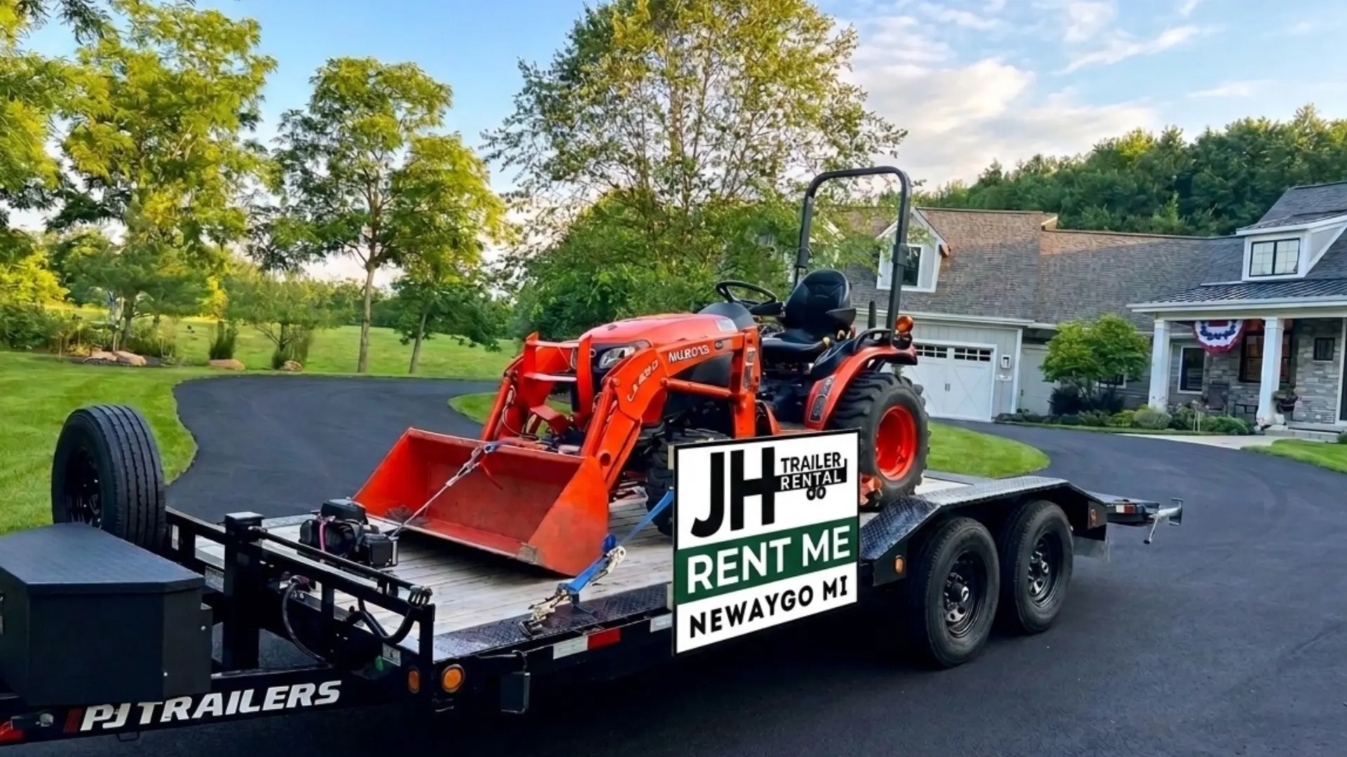 JH Trailer Rental’s PJ hauler carrying a compact tractor
