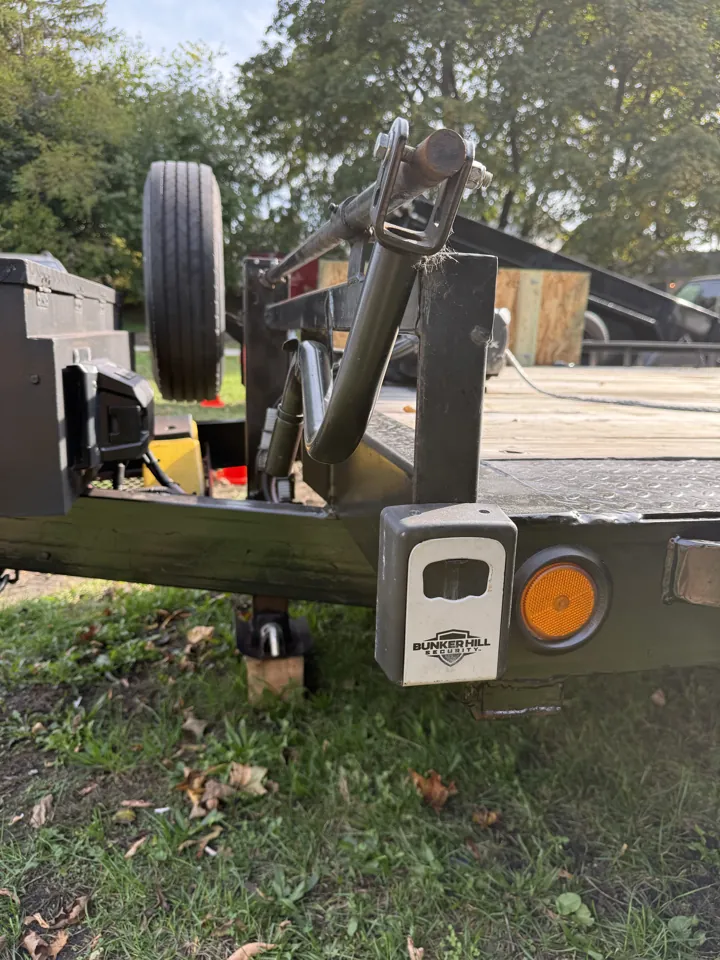 Car hauler lockbox on the front frame beside the jack