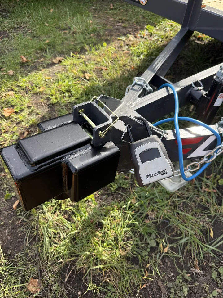 Utility trailer lockbox hanging at the front coupler